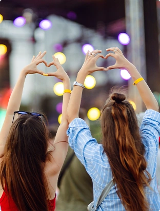 Concert Attendees Forming Heart Shapes with Their Hands