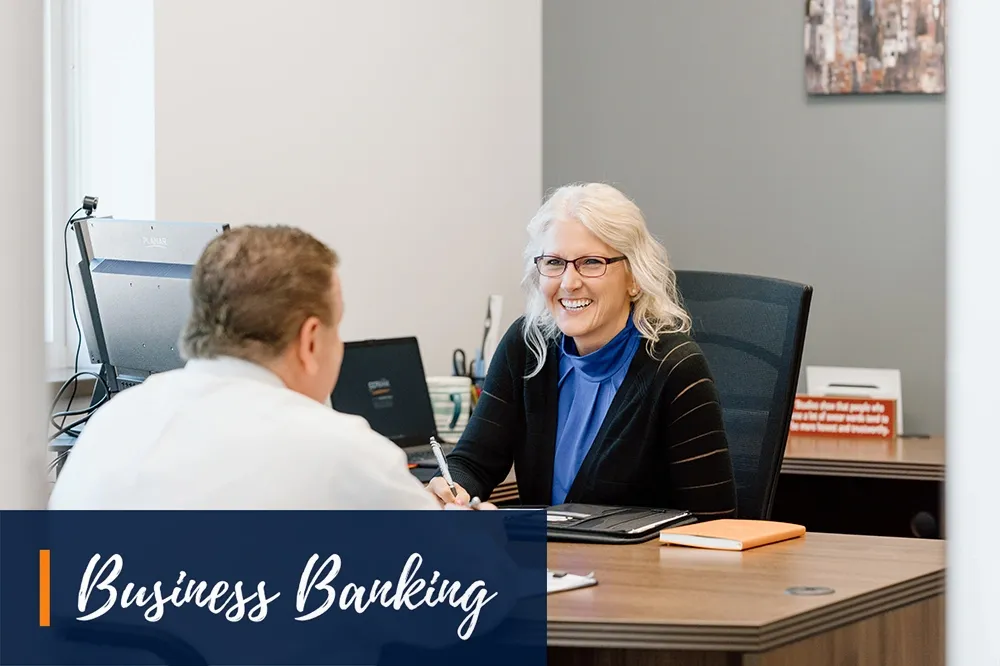 Banker Meeting with Customer in Private Office